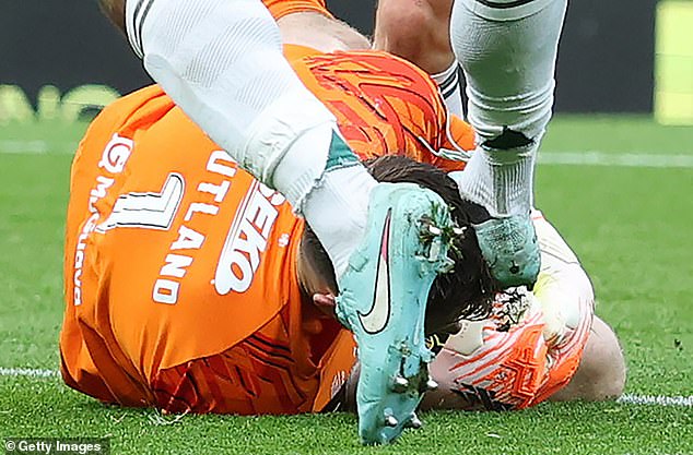 Celtic defender Auston Trusty connects with Jack Butland's head as he lies on the turf