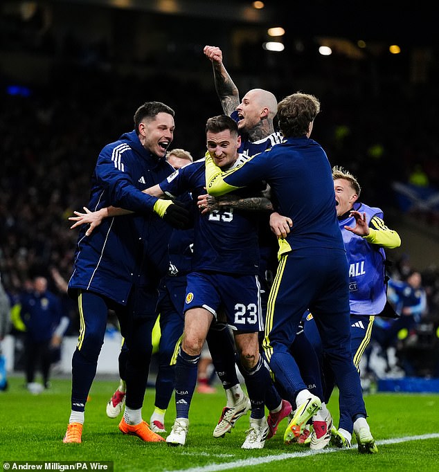 Kenny McLean is mobbed after grabbing a stunning fourth and final goal at Hampden