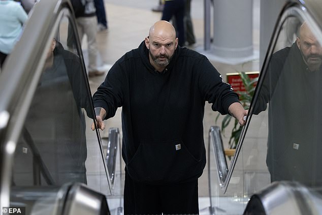 John Fetterman has been rushed to hospital after suffering from a fall this morning. He is pictured near the Senate subway on Capitol Hill in January 2024