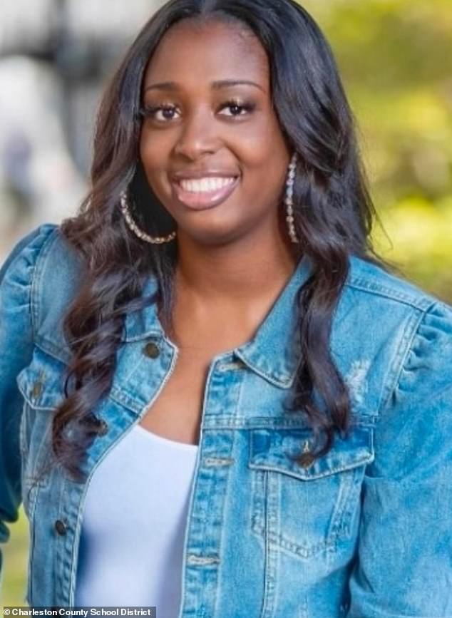 Sade Delesia Nacheyle Nelson, 37, was placed on administrative leave pending an investigation after she was accused of assaulting the father of her child outside a local Walmart