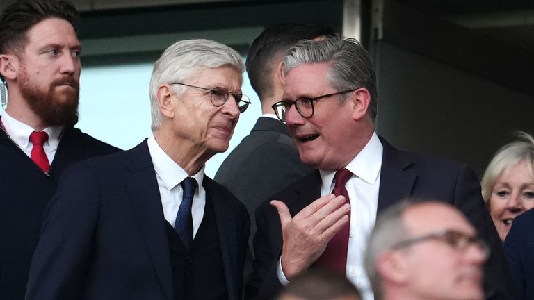 Sir Keir Starmer, pictured at Arsenal's Emirates stadium with former club manager Arsene Wenger, is an avid football fan. Pic: PA