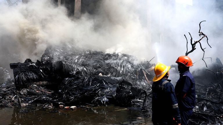 Smoke rises from the wreckage. Pic: Reuters