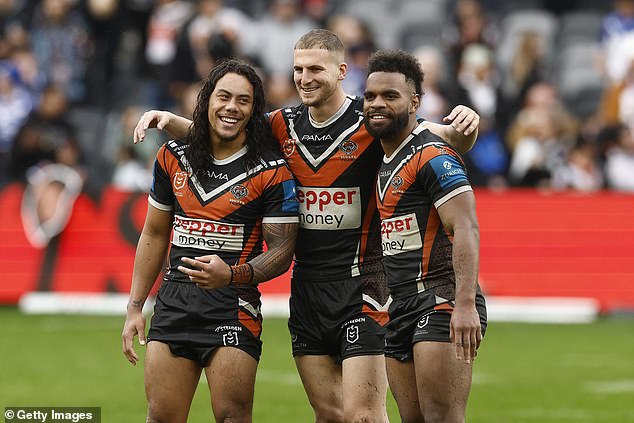 In 2025, Luai (pictured with utility Adam Doueihi, centre, and winger Sunia Turuva) helped the Tigers avoid the wooden spoon for the first time since 2021