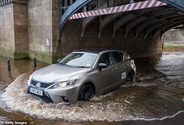 With Britain set to be drenched by a month's worth of rain within 24 hours on Friday, motoring experts have warned drivers not to use one car feature during Storm Claudia...