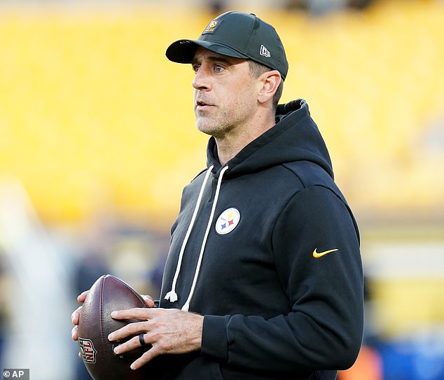 Aaron Rodgers sports a black band on his ring finger. The veteran quarterback said before the NFL season that he was married - but the identity of his wife remains a mystery