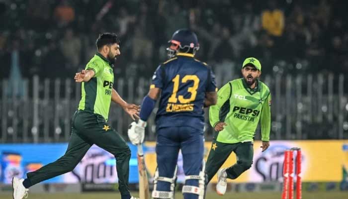 Pakistans Haris Rauf and Babar Azam celebrate a wicket during their first ODI against Sri Lanka, Rawalpindi, November 11, 2025. — AFP