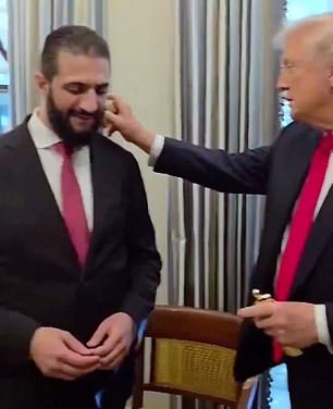 Syria's Ahmed al-Sharaa is spritzed by Trump