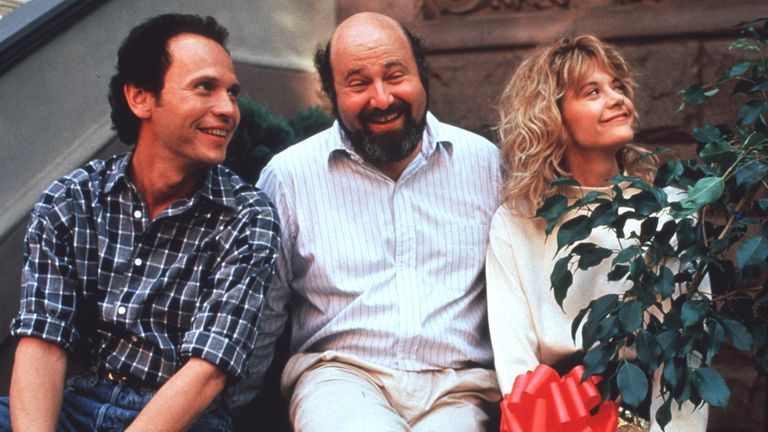 Mr Reiner with Billy Crystal and Meg Ryan on the set of When Harry Met Sally. Pic: THA/Shutterstock