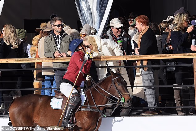 At one point Rebel was pictured leaning down to chat with one of the polo players