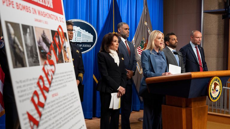 Pam Bondi, Kash Patel, and Dan Bongino at a conference about the 2021 pipe bomb investigation. Pic: AP