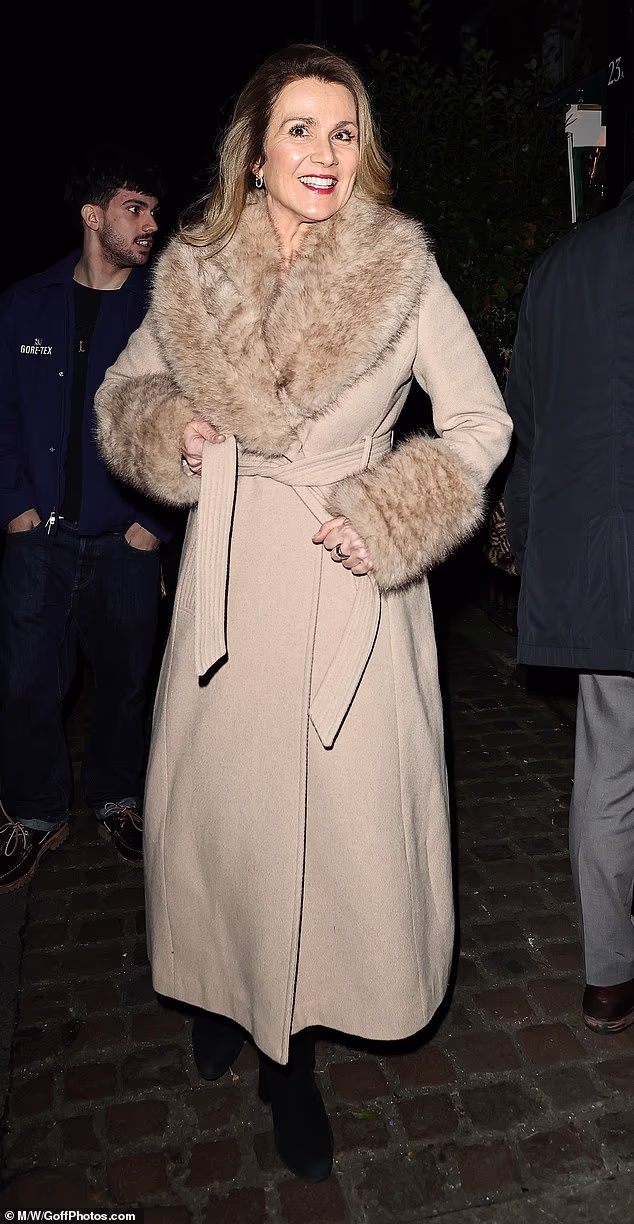 Susanna Reid, 55, meanwhile was effortlessly chic in a light beige maxi-coat with trim fur details
