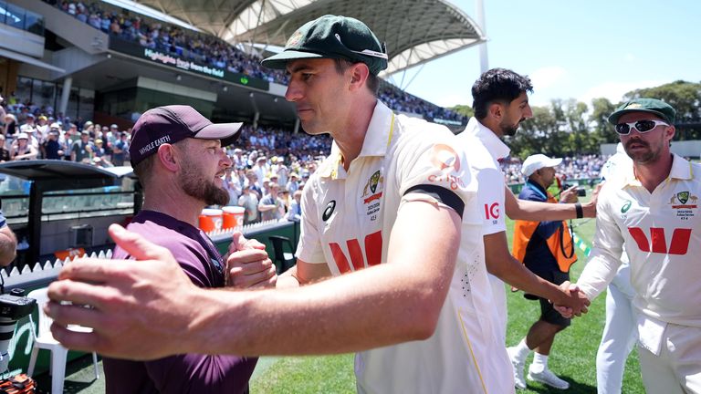 England's head coach Brendan McCullum (left) shakes hands with Australia's Pat Cummins. Pic: PA