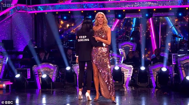 Claudia wore her trademark black jacket with a white blouse and revealed how 'keep dancing' had been stitched into the back - a nod to her and Tess' famous slogan