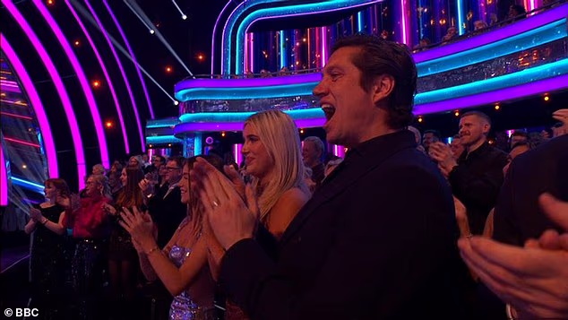 Proud husband Vernon Kay was pictured on his feet in support of Tess, alongside their eldest daughter Phoebe, who Tess was pregnant with during the first series of Strictly