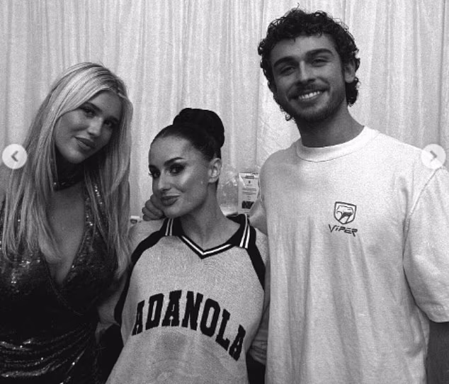 While Phoebe (L) cosied up to finalists Amber Davies (C) and George Clarke (R)