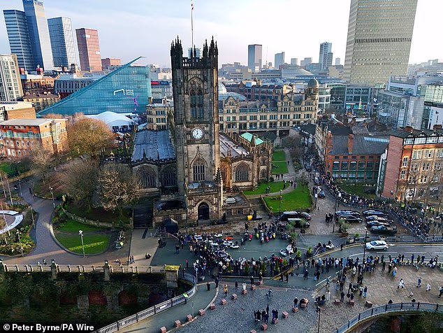 This was the scene overlooking Manchester Cathedral as people gathered to honour Mani
