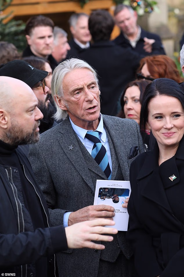 Paul Weller was among today's mourners, seen holding an order of service outside the service