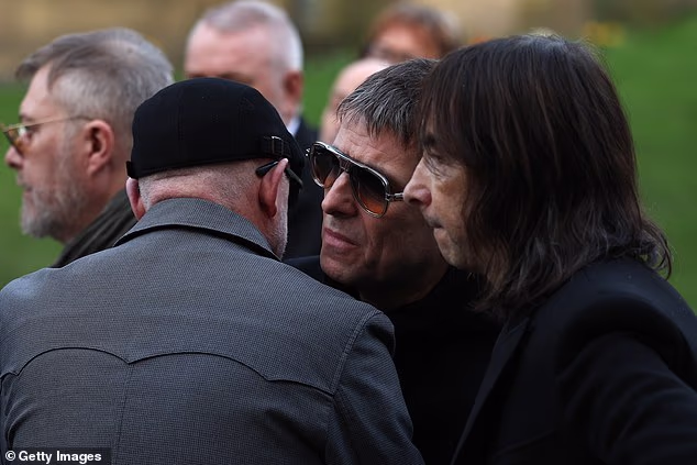 Also there and among the pallbearers were Liam Gallagher (centre) and Bobby Gillespie (right)