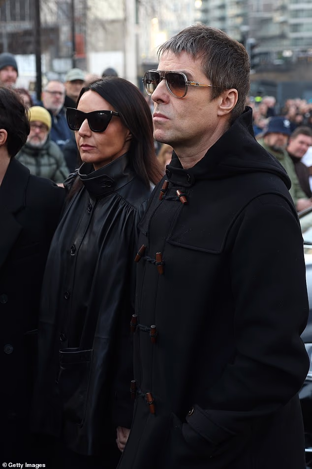 He was seen in Manchester today looking sombre, alongside his partner Debbie Gwyther