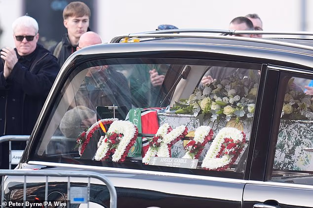 Another floral tribute reads an affectionate message of 'R KID'