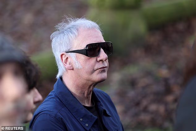 Clint Boon from fellow Manchester band the Inspiral Carpets is seen at today's funeral