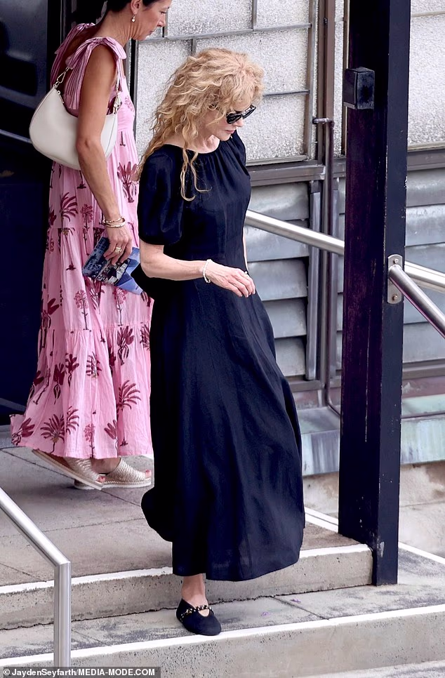 She moved quietly, blending into the subdued Christmas morning atmosphere in the North Sydney neighbourhood