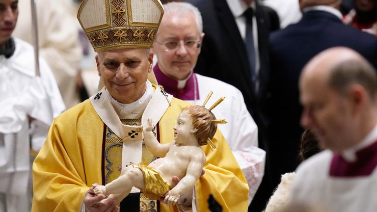 The Pope held a the statue of Baby Jesus during at a Christmas Mass. Pic: AP