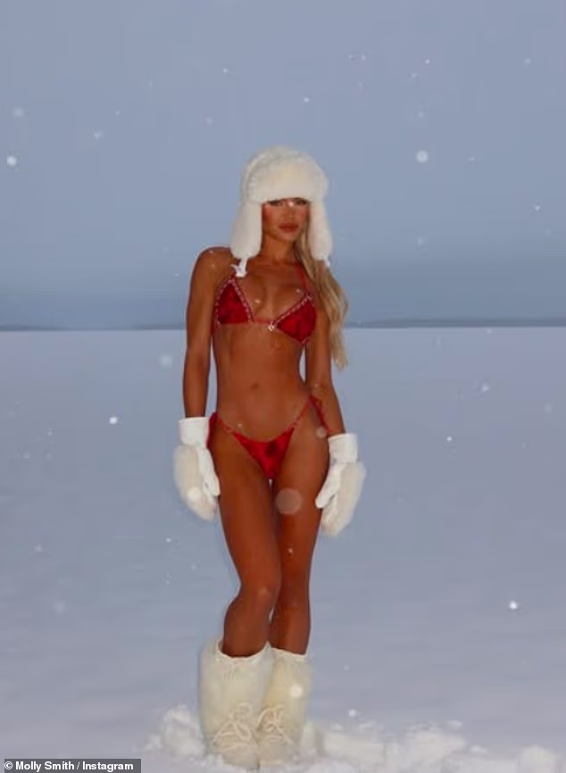 A very tanned Molly teamed the busty red bikini with fur white boots, a matching hat and warm gloves