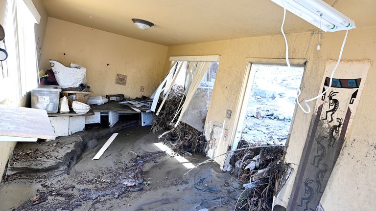 Mud covers a property in Wrightwood, California. Pic: AP/William Liang