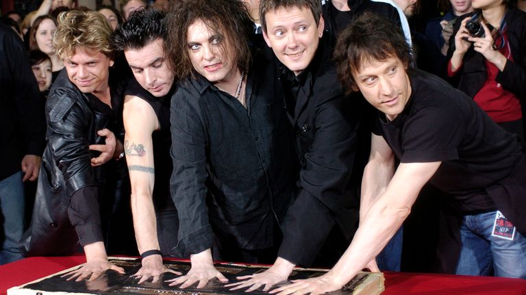 The Cure with Robert Smith (centre) and Perry Bamonte (right) at Hollywood's Rockwalk in Los Angeles in 2004. Pic: AP
