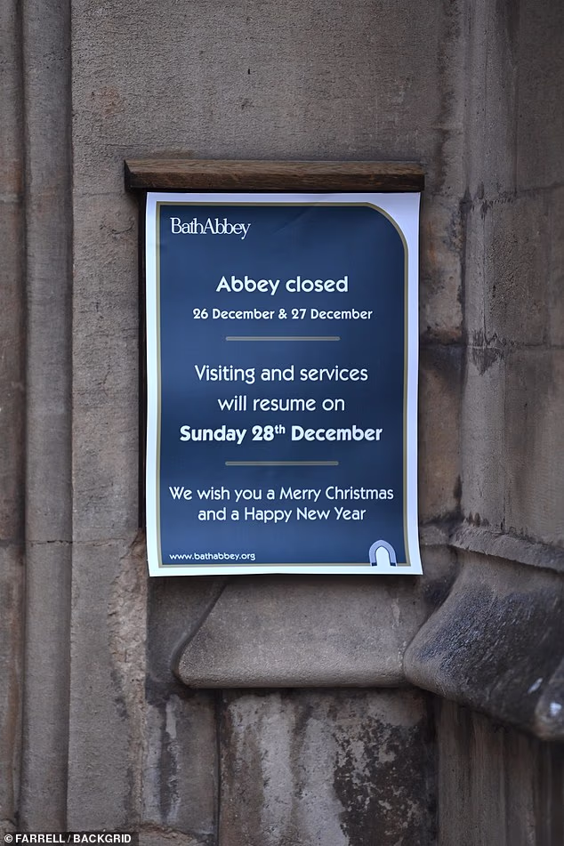 A sign outside Bath Abbey saying how the visiting and services are closed until December 28