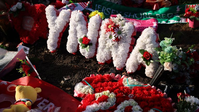 Flowers are laid in tribute outside the stadium before the match. Pic. Reuters