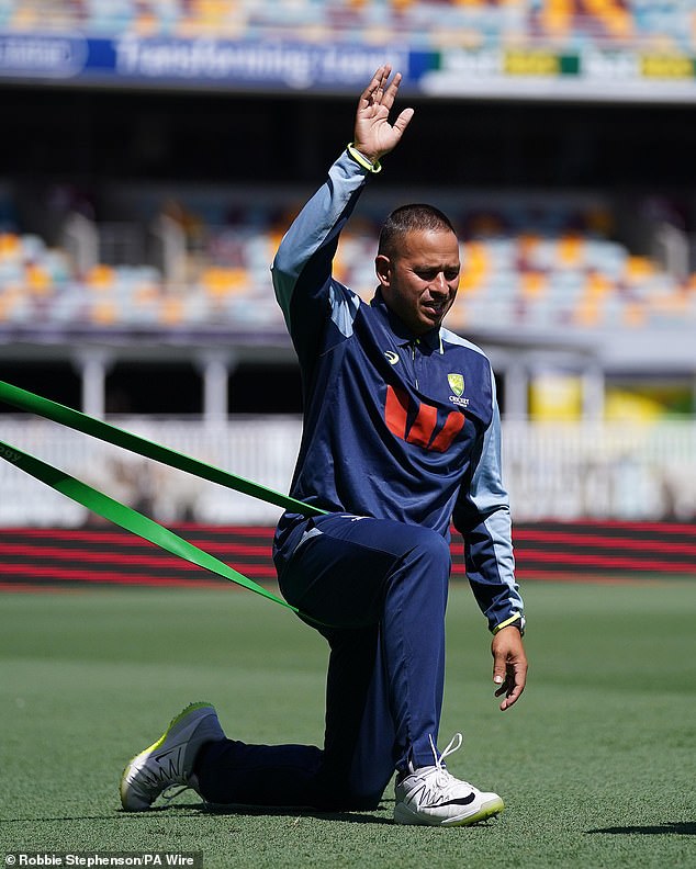 Usman Khawaja is out of the second Test after the back injury that led to farcical scenes in Perth saw him pull up sore after training at the Gabba (pictured)