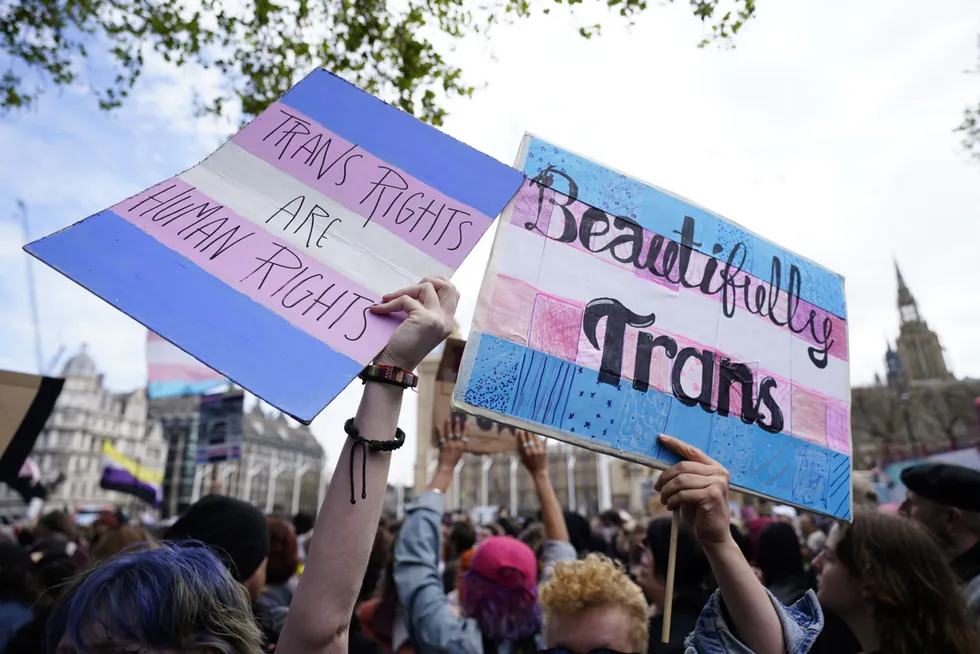 Pro-trans protesters gather outside the Supreme Court