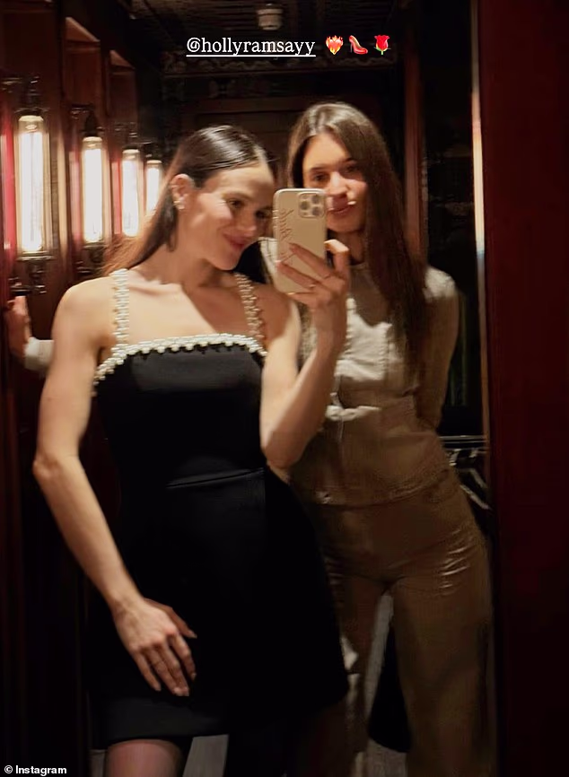 The toxic family feud currently overshadowing Holly Ramsay's imminent wedding to Adam Peaty was brushed aside on Monday evening as they dined with friends out at her father's Mayfair restaurant