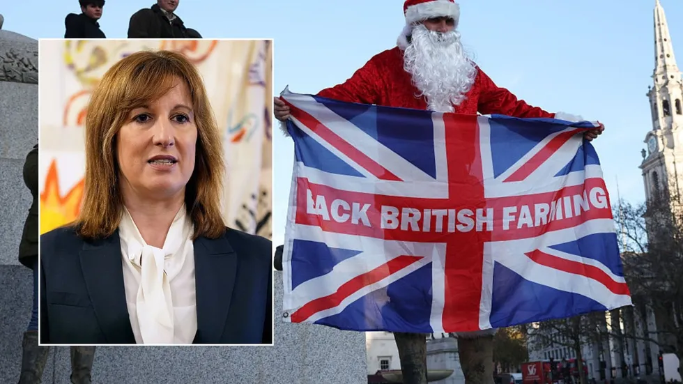 Protestor in Santa constume and Rachel Reeves