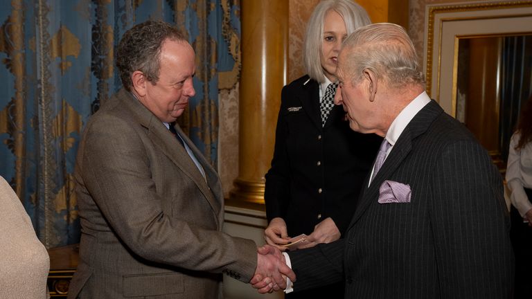 The King greets the train's driver, Andrew Johnson. Pic: PA