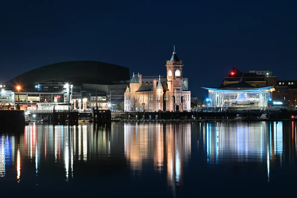 A general view of Cardiff Bay at night showing the Pierhead Building (C) and Senedd (R), home of the Welsh Parliament