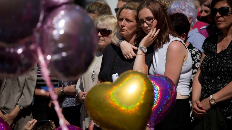 People hold a minute of silence in a square in central Manchester, on 25 May 2017. Pic: AP             