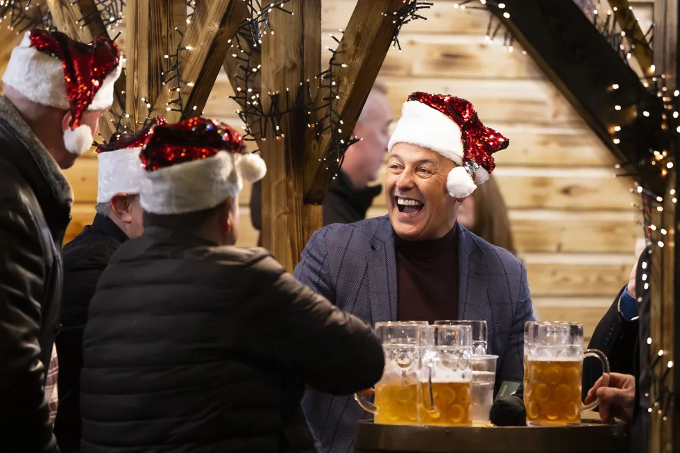 Group of men in santa hats at the pub