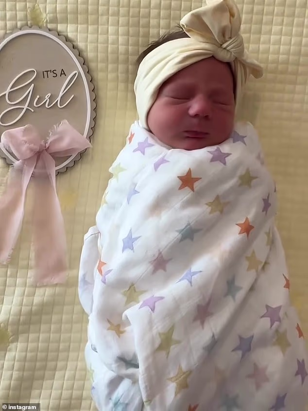 Posting the happy news in a joint share, the delighted couple included a video of their new baby girl and revealed her name as Zimi Wren Clifford (pictured)