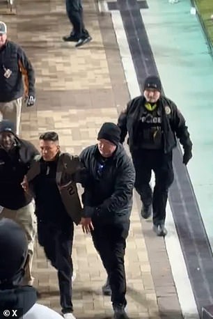 Javier was seen being escorted out of the stadium by officials