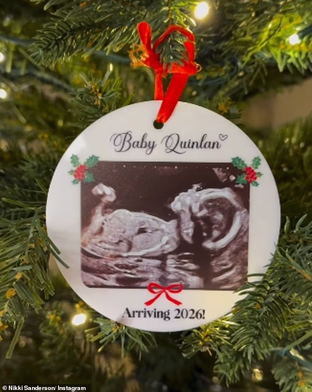 Sharing a sweet video of a Christmas tree on Instagram on Wednesday, the pair zoomed in on a bauble which had an image of a baby scan
