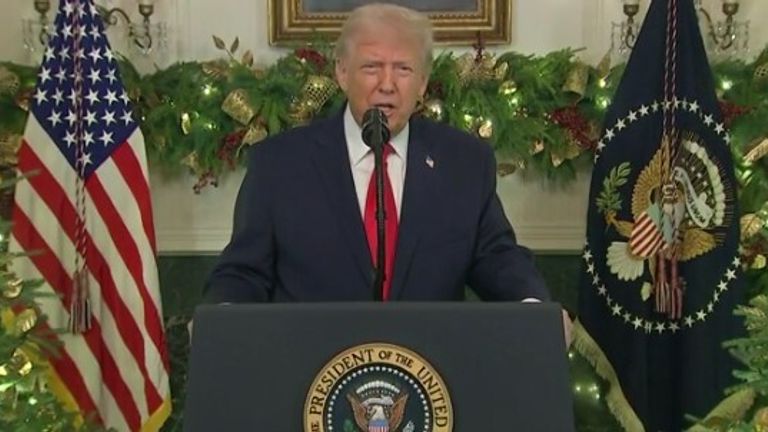 Flanked by Christmas trees, but the speech hardly offered goodwill to all men