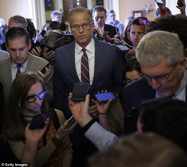 Trump has called on Senate Majority Leader John Thune (pictured center) to 'nuke' the filibuster multiple times