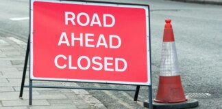 Major road remains closed for drivers after man shot dead by police