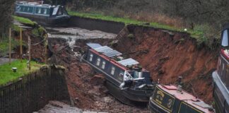 Video shows canal boat falling into huge hole after Whitchurch embankment collapse | UK News