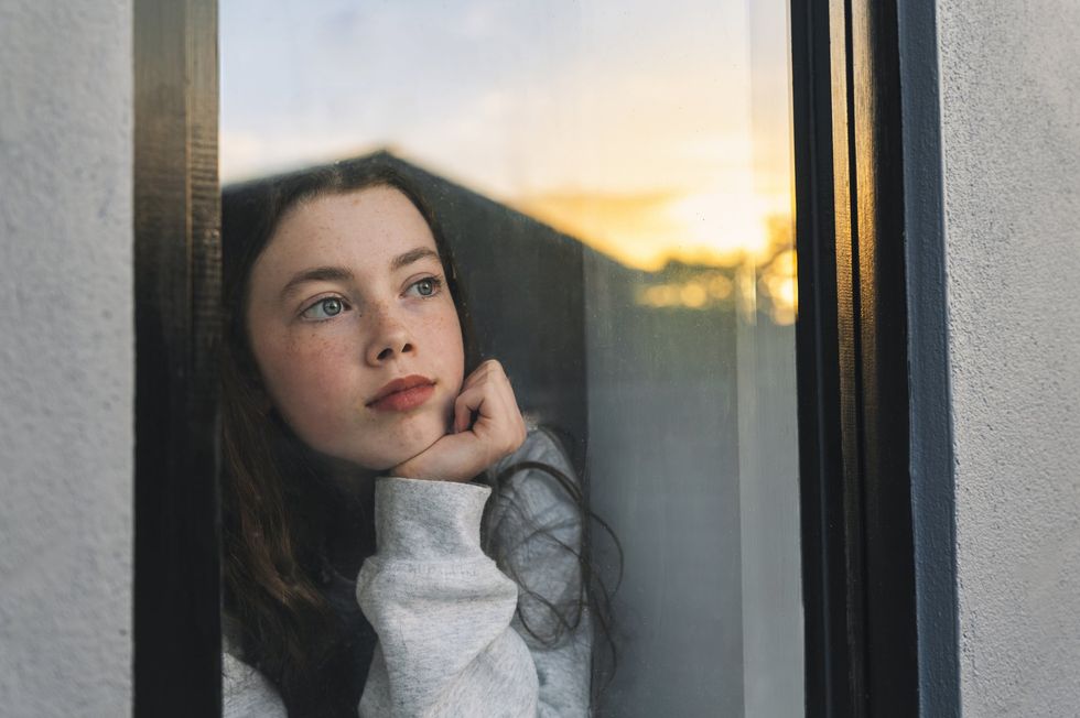 Child looking out of window