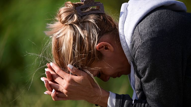 A family member of a detainee waits outside the El Rodeo jail after it was announced political prisoners would be released.
Pic: Reuters