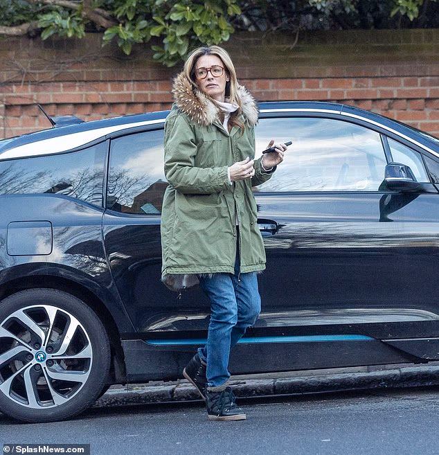 The TV presenter, 49, looked stylish in a pair of oversized aviator glasses and wrapped up warm in a khaki green parka with a fur-lined hood